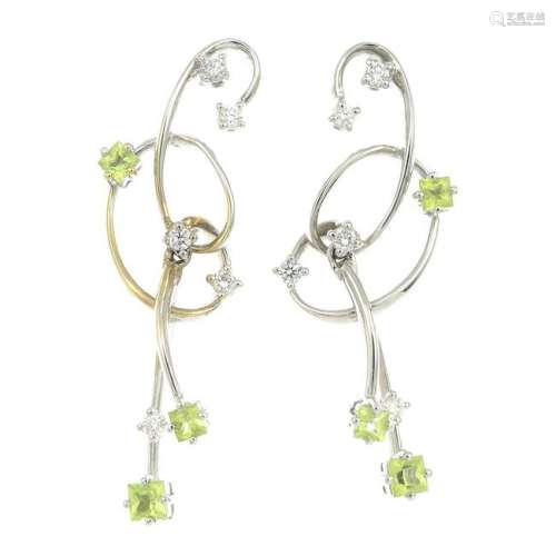 An 18ct gold diamond and peridot earrings.Estimated