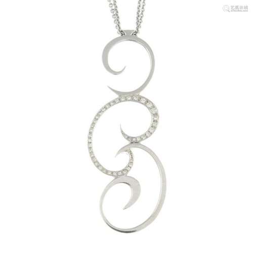 An 18ct gold diamond swirl pendant, suspended from a