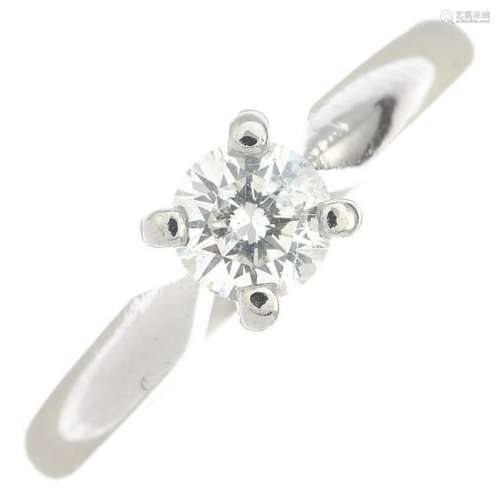 A platinum brilliant-cut diamond single-stone ring.