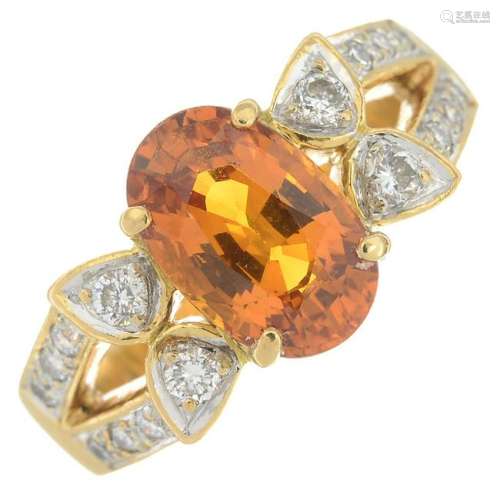An orange sapphire and diamond ring.Sapphire calculated