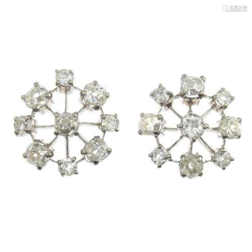 A pair of vari-cut diamond cluster earrings.Estimated