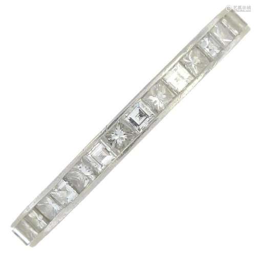 A square-cut diamond eternity ring. Estimated total