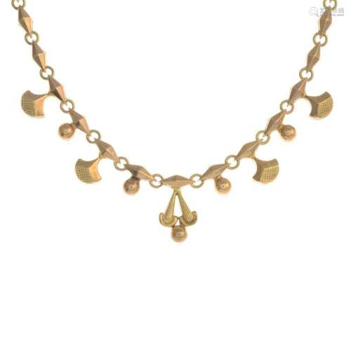An early 20th century gold necklace.Stamped 9ct.Length