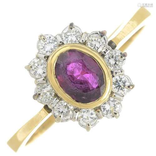 An 18ct gold ruby and diamond cluster ring.Estimated