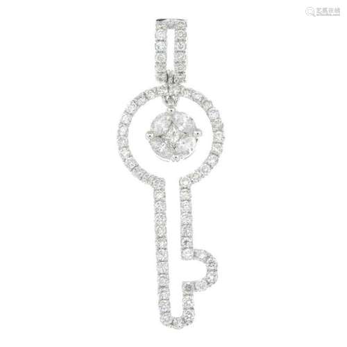 A diamond key pendant.Total diamond weight