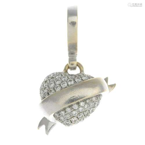 An 18ct gold diamond heart pendant.One diamond