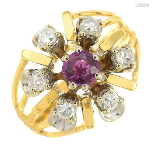 An 18ct gold ruby and diamond cluster ring.Estimated