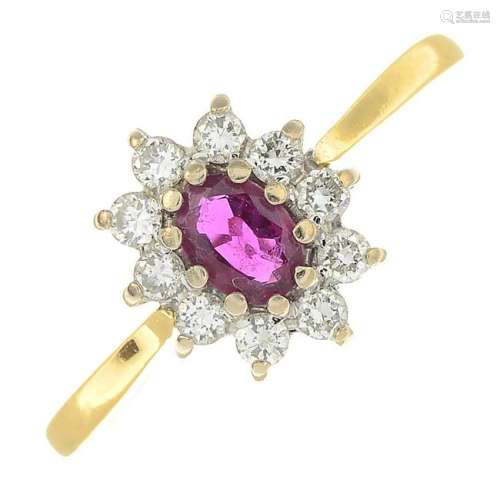 An 18ct gold ruby and diamond cluster ring.Estimated