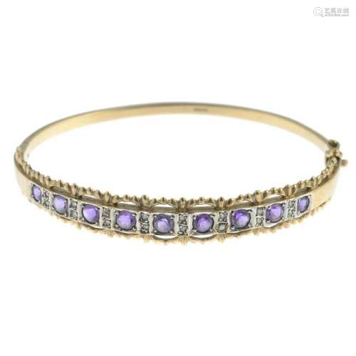 An amethyst and diamond hinged bangle, with plain