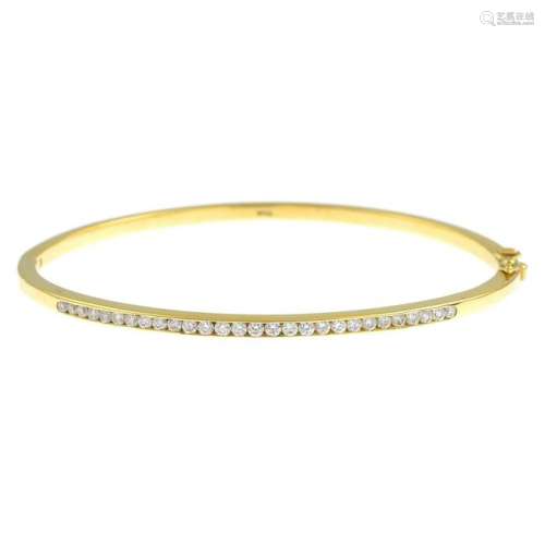 An 18ct gold brilliant-cut diamond hinged bangle, with