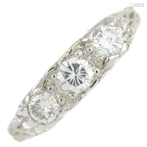 A brilliant-cut diamond three-stone ring.Estimated