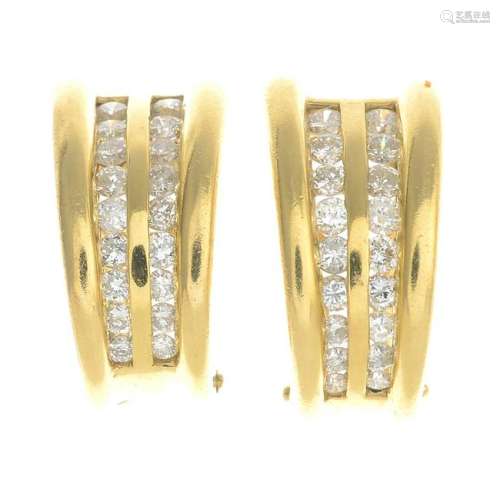 A pair of 18ct gold diamond earrings.Estimated total