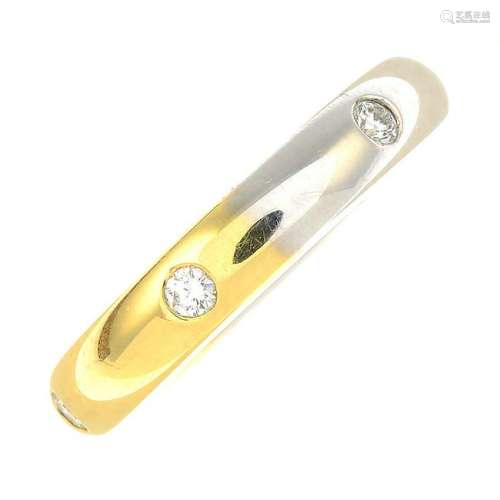 An 18ct gold bi-colour diamond band ring.Total diamond