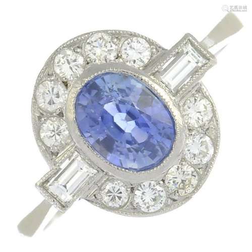 A sapphire and diamond dress ring.Sapphire calculated