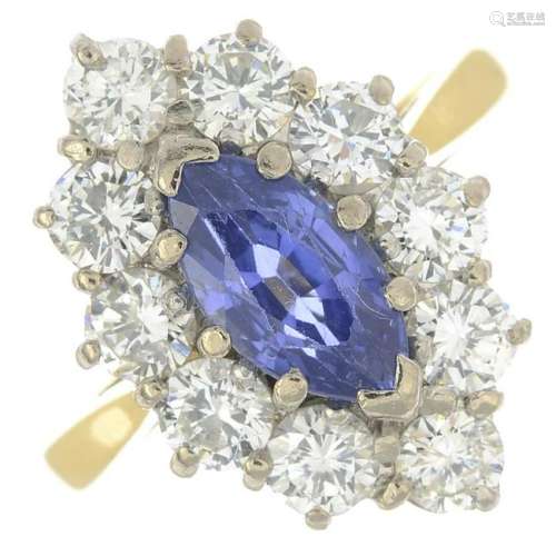 An 18ct gold sapphire and diamond cluster ring.Sapphire