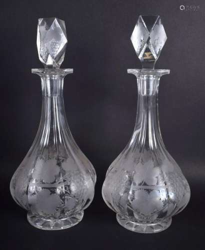 A LARGE PAIR OF 19TH CENTURY ENGRAVED GLASS DECANTERS