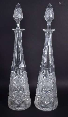 A LARGE PAIR OF ANTIQUE ENGRAVED GLASS DECANTERS AND