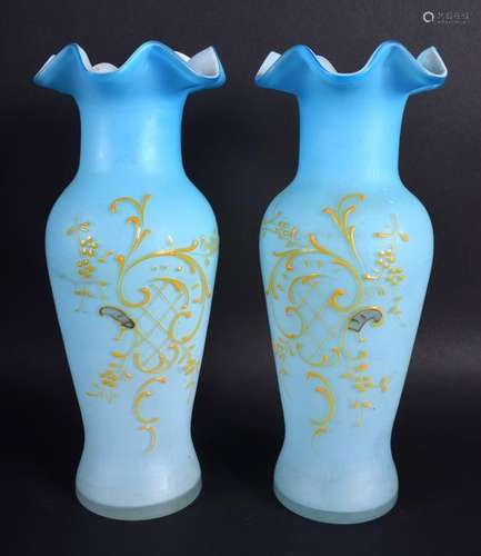 A PAIR OF EDWARDIAN BLUE VASELINE GLASS VASES. 26 cm