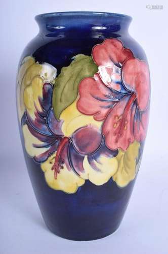 A WILLIAM MOORCROFT POWDER BLUE VASE decorated with