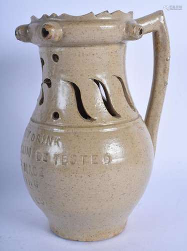 A STUDIO POTTERY GENTLEMAN'S DRINK POTTERY PUZZLE JUG.