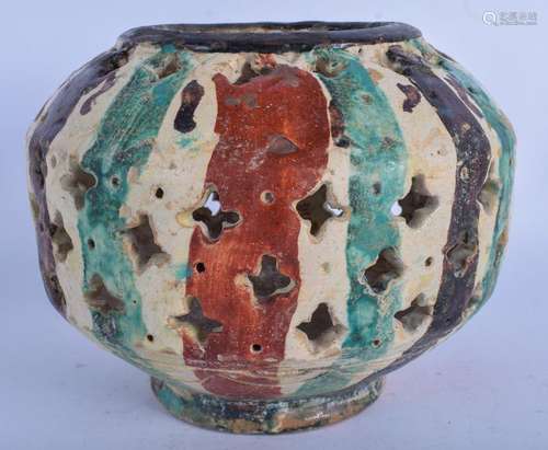 AN ISLAMIC MIDDLE EASTERN POTTERY OPEN WORK BOWL. 17 cm