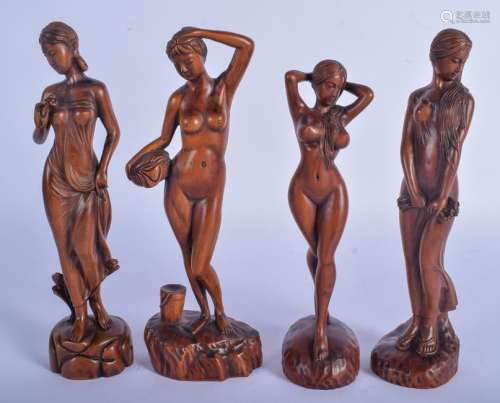 A SET OF FOUR CONTINENTAL CARVED WOOD FIGURES OF NUDE