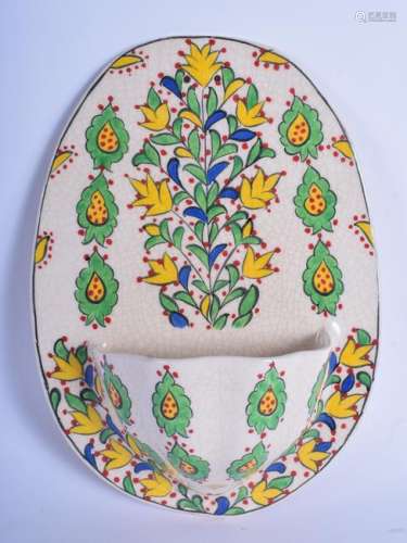 A TURKISH FAIENCE KUTAHYA FONT painted with foliage. 18