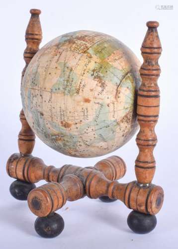 AN UNUSUAL 19TH CENTURY REVOLVING GLOBE upon a wooden