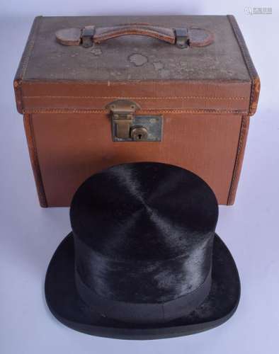 AN ANTIQUE CASED TOP HAT within a leather box, Walter