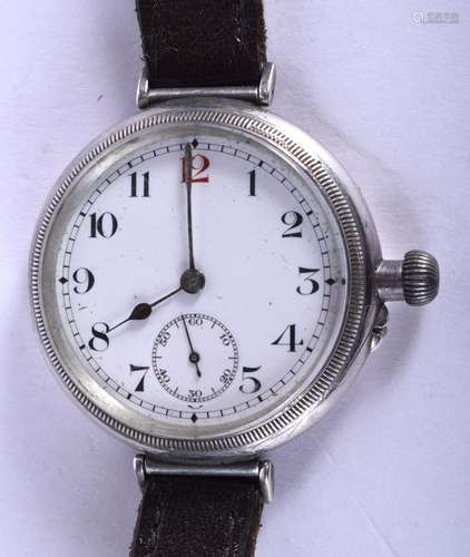 AN EARLY 20TH CENTURY SILVER TRENCH STYLE WRISTWATCH.