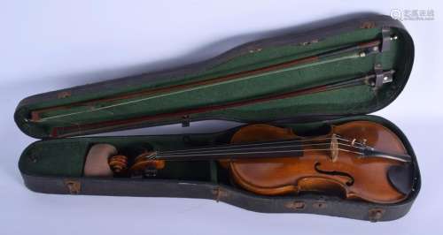 AN ANTIQUE VIOLIN with two bows, bearing label to