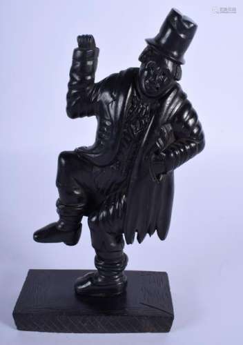 AN EARLY 20TH CENTURY CONTINENTAL EBONY FIGURE OF A