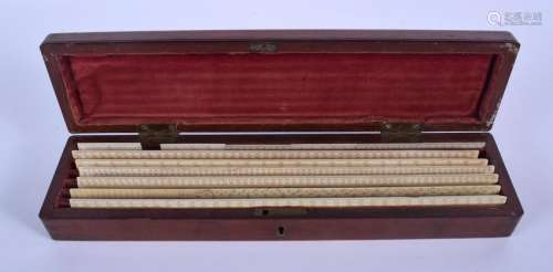 A CASED SET OF VICTORIAN CARVED I RULERS within a