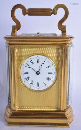 AN ANTIQUE FRENCH REPEATING BRASS CARRIAGE CLOCK with