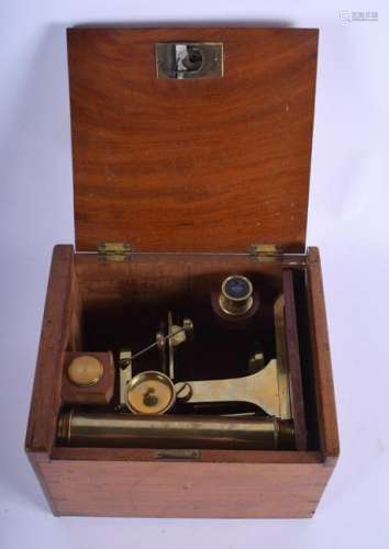 A 19TH CENTURY BRASS MICROSCOPE within original fitted