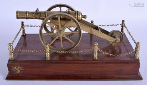 AN EDWARDIAN BRASS SIGNAL TABLE CANNON modelled upon a