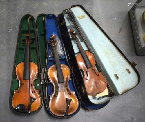 THREE VINTAGE VIOLINS IN CASES together with bows. (3)