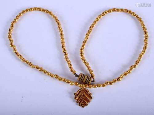 AN ISLAMIC MIDDLE EASTERN YELLOW METAL CHAIN. 9.4