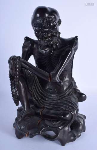 A 19TH CENTURY CHINESE CARVED HARDWOOD FIGURE OF A