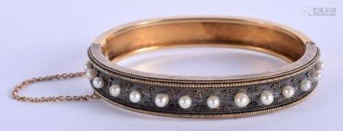 A VICTORIAN 15CT PEARL BANGLE. 17.2 grams. 7 cm x 5.5