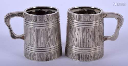 A PAIR OF 19TH CENTURY RUSSIAN SILVER TANKARDS. 80