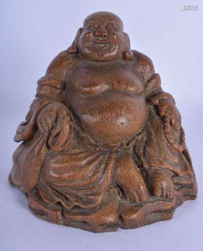 A 19TH CENTURY CHINESE CARVED BAMBOO FIGURE OF A BUDDHA