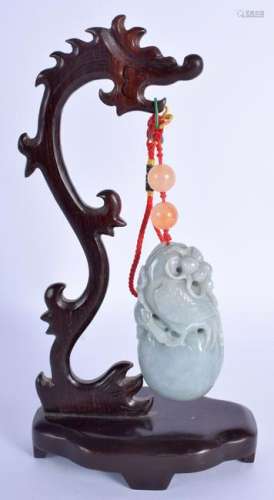 A CHINESE CARVED JADEITE PENDANT BOULDER 20th Century.