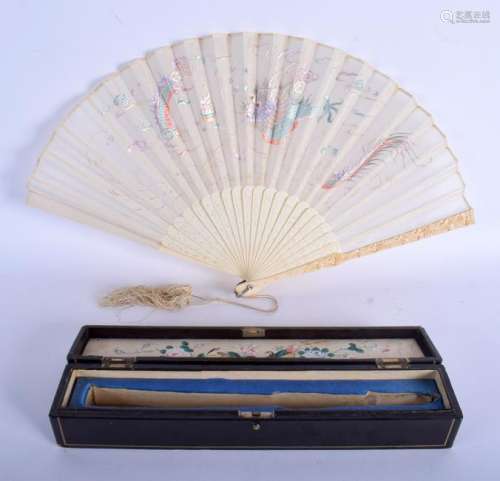A 19TH CENTURY CHINESE CARVED I AND SILK FAN within a