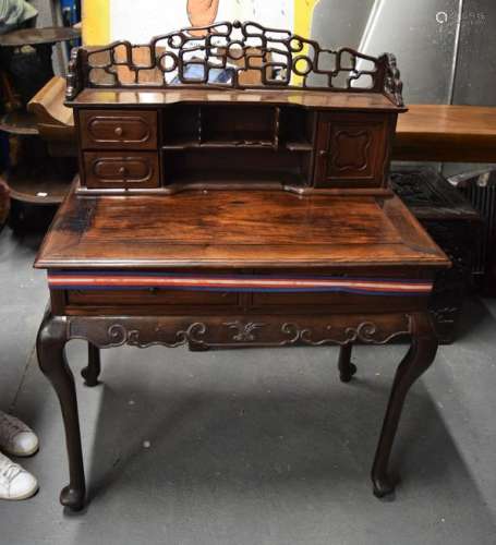 AN EARLY 20TH CENTURY CHINESE CARVED HARDWOOD DESK