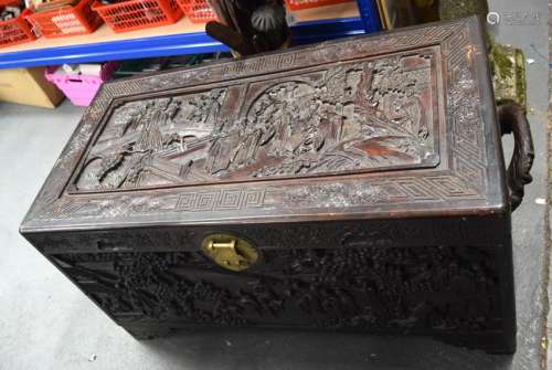 A CHINESE QING DYNASTY CAMPHORWOOD CHEST, boldly carved