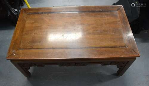 A CHINESE QING DYNASTY HARDWOOD TABLE carved with cloud