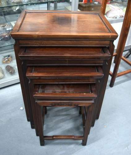 AN EARLY 20TH CENTURY CHINESE HARDWOOD NEST OF TABLES