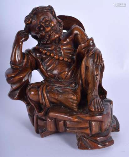A 19TH CENTURY CHINESE CARVED ROOT WOOD FIGURE OF A