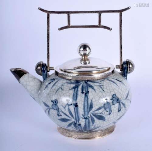 AN ASIAN SILVER MOUNTED TEAPOT AND COVER painted with